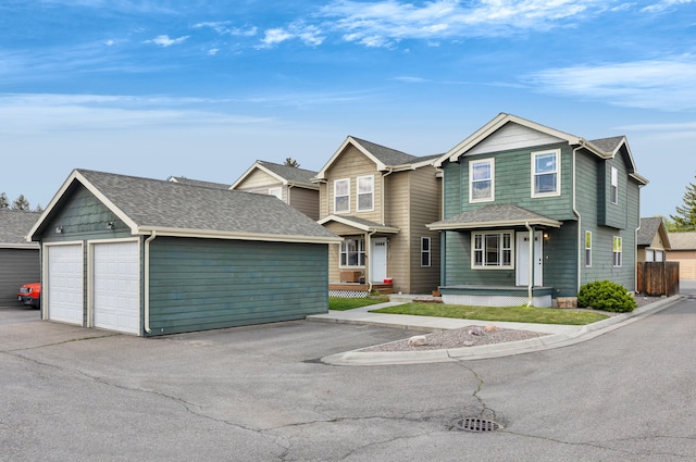 view of front of property with an outbuilding and a garage