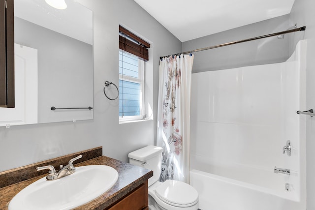 full bathroom featuring toilet, vanity, and shower / bath combo with shower curtain