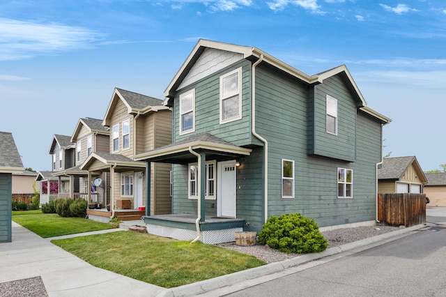 view of front of home with covered porch and a residential view