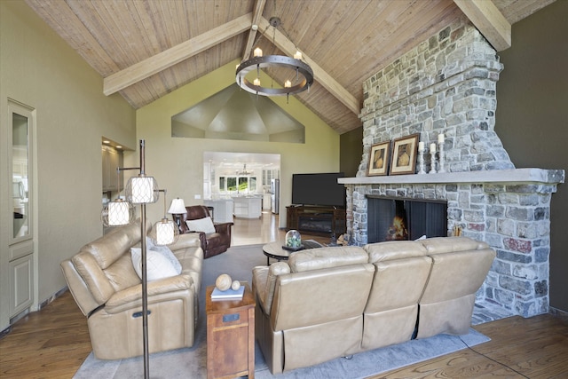 215 Browns Gulch Rd, Kalispell, MT 59901 - living area with wood ceiling with exposed beams, wood finished floors, a fireplace, and high vaulted ceiling