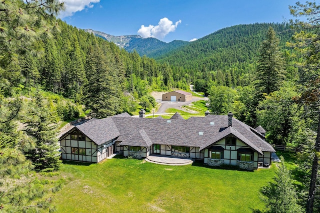 215 Browns Gulch Rd, Kalispell, MT 59901 - view of subject property featuring a forest and mountains
