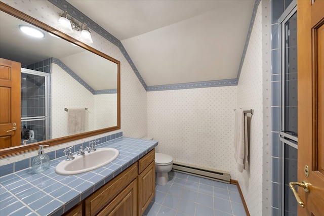 215 Browns Gulch Rd, Kalispell, MT 59901 - full bathroom with a baseboard radiator, vaulted ceiling, toilet, vanity, and wallpapered walls