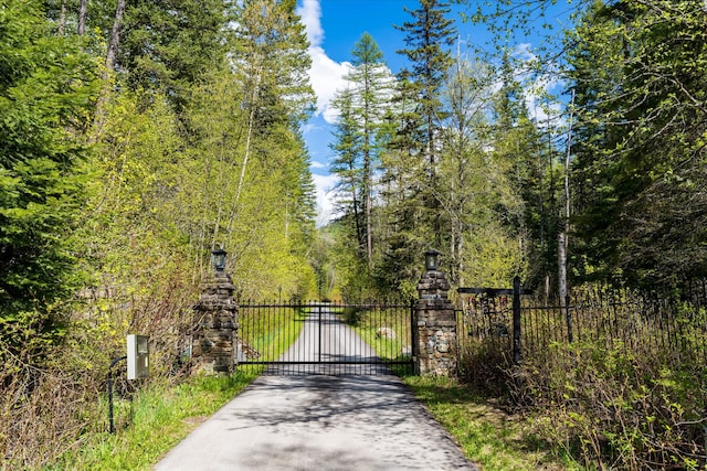 215 Browns Gulch Rd, Kalispell, MT 59901 - gate with a wooded view