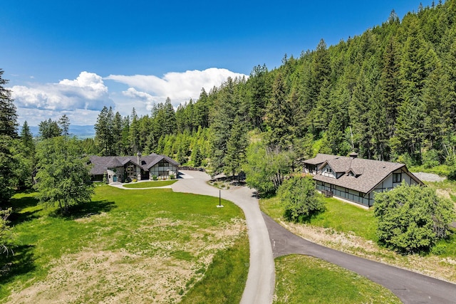 215 Browns Gulch Rd, Kalispell, MT 59901 - aerial view of property and surrounding area with a heavily wooded area