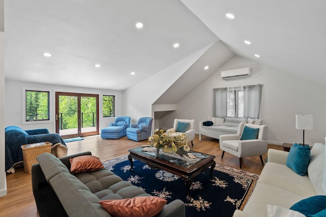 215 Browns Gulch Rd, Kalispell, MT 59901 - living area featuring an AC wall unit, recessed lighting, light wood-style flooring, and vaulted ceiling