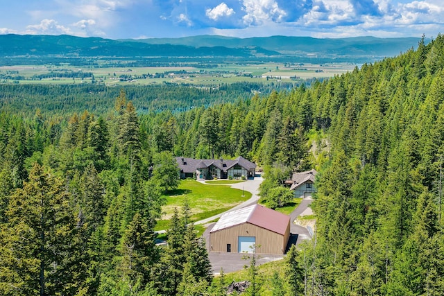 215 Browns Gulch Rd, Kalispell, MT 59901 - view of subject property featuring a mountainous background and a heavily wooded area
