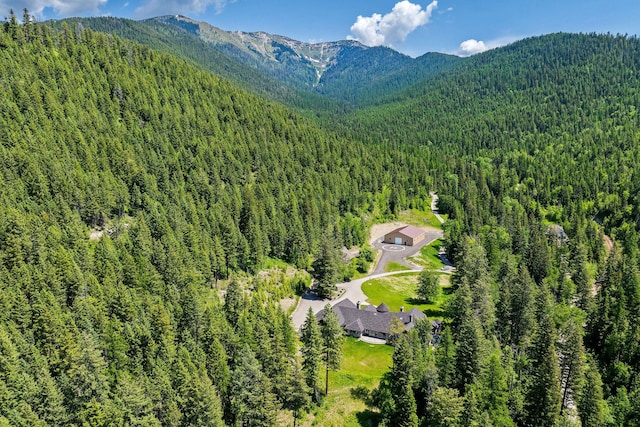 215 Browns Gulch Rd, Kalispell, MT 59901 - drone / aerial view of a forest and a mountainous background