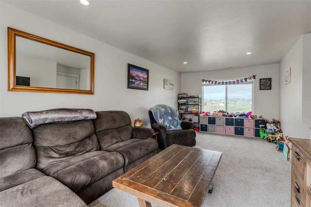 carpeted living area with recessed lighting