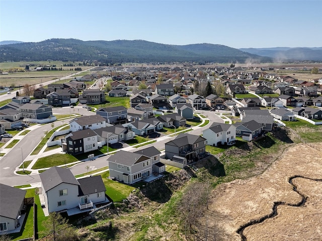 aerial view of residential area featuring mountains