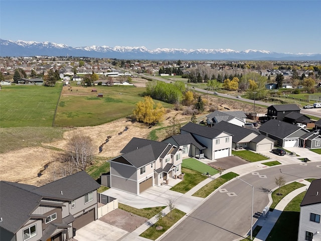 aerial view of residential area featuring a mountain backdrop