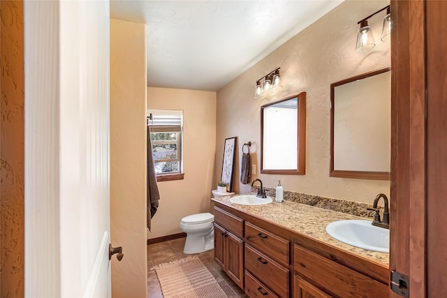 11818 Stella Blue Dr, Lolo, MT 59847 - full bathroom featuring toilet, double vanity, and tile patterned floors