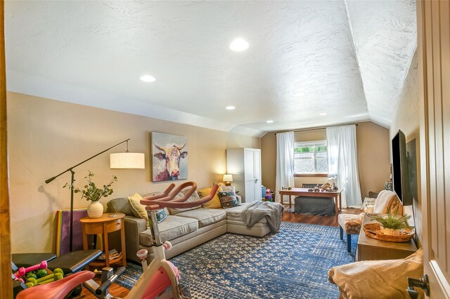 11818 Stella Blue Dr, Lolo, MT 59847 - living room featuring vaulted ceiling, wood finished floors, and recessed lighting