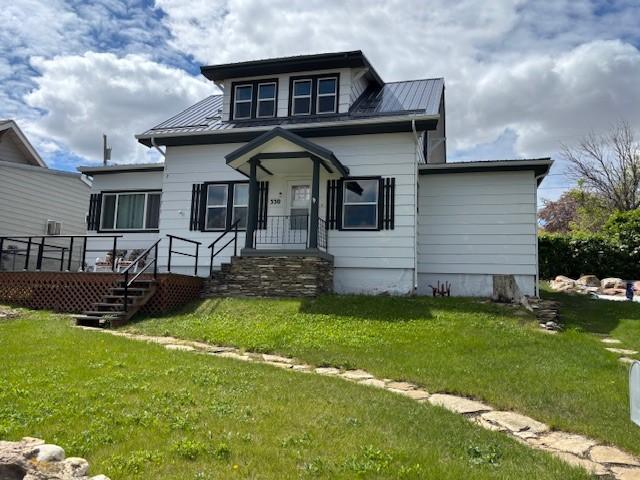 330 2nd St S, Shelby, MT 59474 - bungalow featuring a front lawn and metal roof