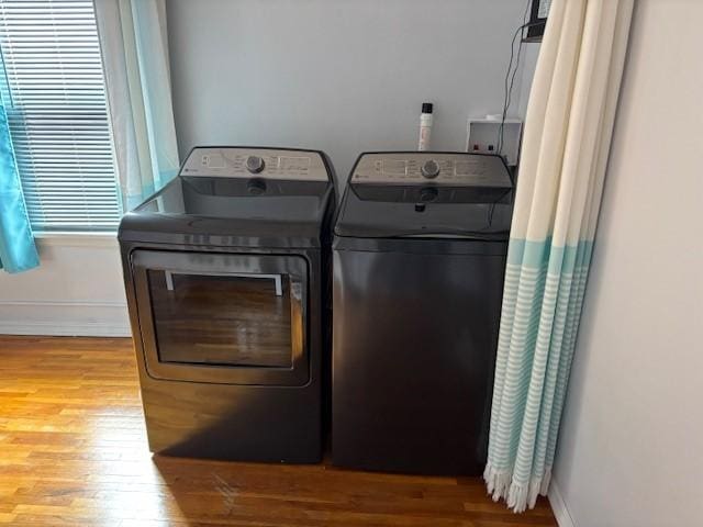 330 2nd St S, Shelby, MT 59474 - laundry room featuring washer and clothes dryer, wood finished floors, and baseboards