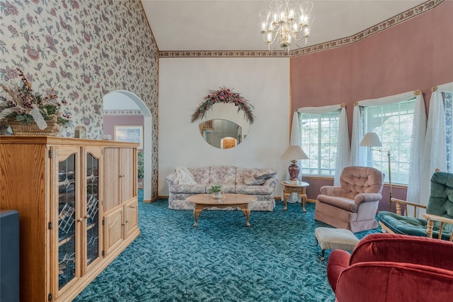 527 Grande Vista Dr, Kalispell, MT 59901 - carpeted living room with arched walkways, baseboards, a chandelier, and a high ceiling