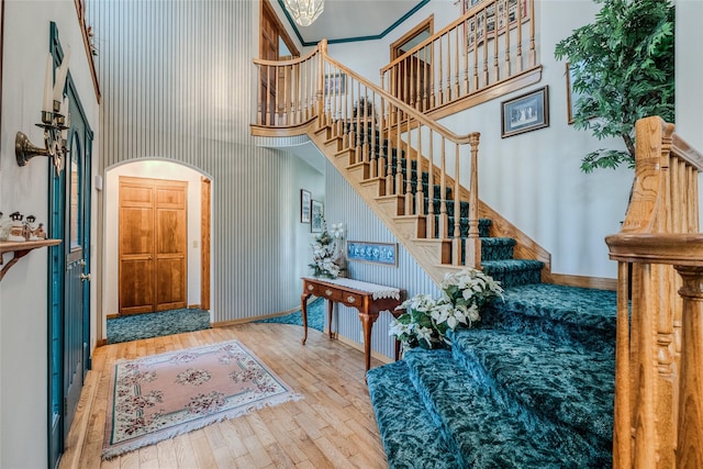 527 Grande Vista Dr, Kalispell, MT 59901 - entryway with a towering ceiling, stairway, hardwood / wood-style flooring, baseboards, and a chandelier