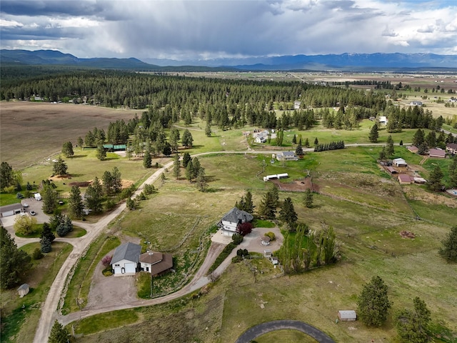 527 Grande Vista Dr, Kalispell, MT 59901 - aerial overview of property's location featuring a mountainous background and rural landscape