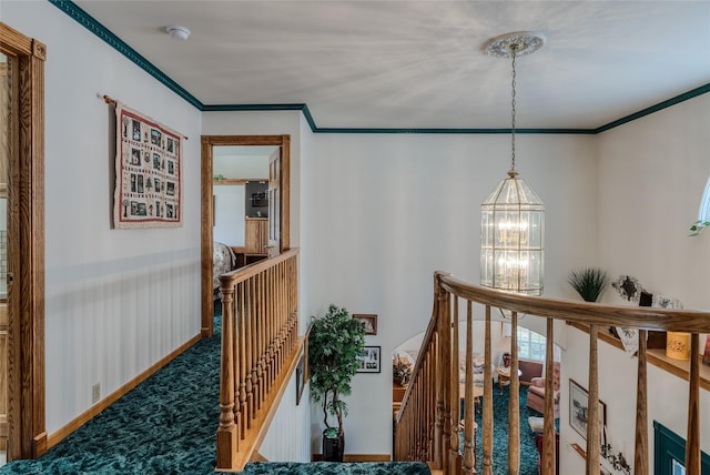 527 Grande Vista Dr, Kalispell, MT 59901 - corridor featuring an upstairs landing, a chandelier, crown molding, and carpet floors