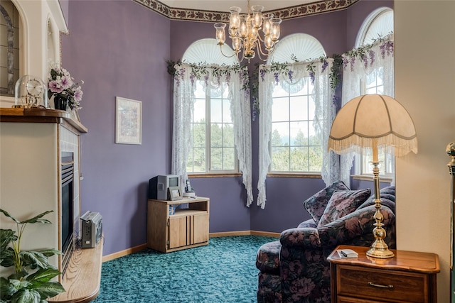 527 Grande Vista Dr, Kalispell, MT 59901 - living area featuring carpet, a chandelier, a tile fireplace, and baseboards