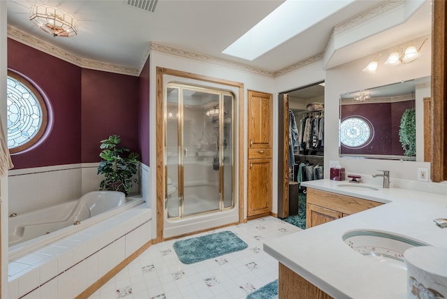 527 Grande Vista Dr, Kalispell, MT 59901 - bathroom with a shower stall, a jetted tub, healthy amount of natural light, and double vanity