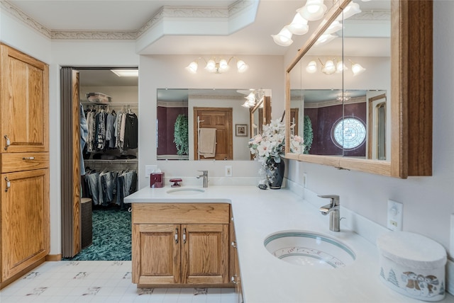 527 Grande Vista Dr, Kalispell, MT 59901 - bathroom with tile patterned floors, double vanity, and a walk in closet