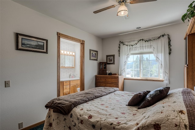 527 Grande Vista Dr, Kalispell, MT 59901 - bedroom with connected bathroom, ceiling fan, and baseboards