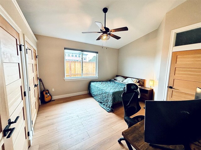 687 Road Runner St Unit B, Helena, MT 59602 - bedroom featuring light wood-type flooring, vaulted ceiling, baseboards, a ceiling fan, and an office area