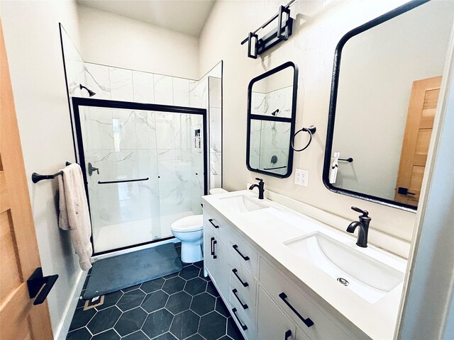687 Road Runner St Unit B, Helena, MT 59602 - full bath featuring toilet, a marble finish shower, tile patterned floors, and double vanity