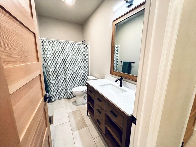 687 Road Runner St Unit B, Helena, MT 59602 - bathroom featuring vanity, toilet, tile patterned floors, and a shower with shower curtain