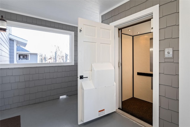 2060 Marina Ct, Bigfork, MT 59911 - bathroom with finished concrete floors and elevator