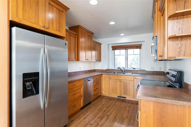 2060 Marina Ct, Bigfork, MT 59911 - kitchen with appliances with stainless steel finishes, open shelves, a sink, wood finished floors, and recessed lighting