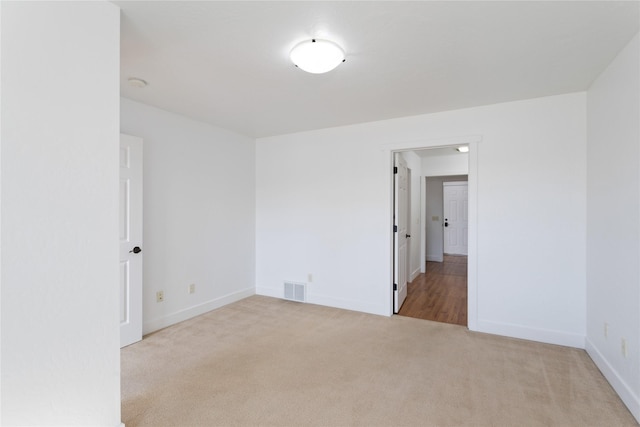 2060 Marina Ct, Bigfork, MT 59911 - carpeted spare room featuring baseboards