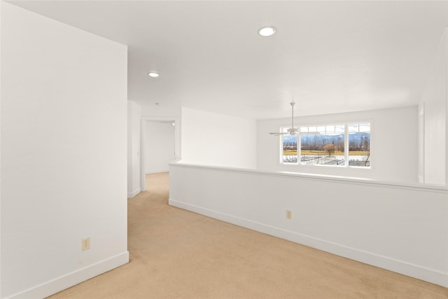 2060 Marina Ct, Bigfork, MT 59911 - empty room with light carpet, baseboards, recessed lighting, and a chandelier