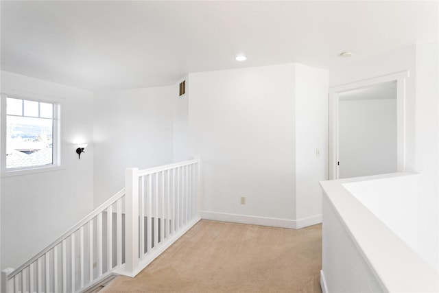 2060 Marina Ct, Bigfork, MT 59911 - corridor with an upstairs landing, light carpet, and baseboards