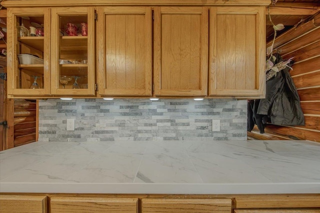 6470 US Highway 93 S, Eureka, MT 59917 - kitchen featuring light countertops, glass insert cabinets, and decorative backsplash