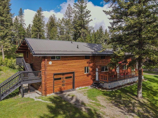6470 US Highway 93 S, Eureka, MT 59917 - back of house with stairway, log exterior, a deck, and a yard