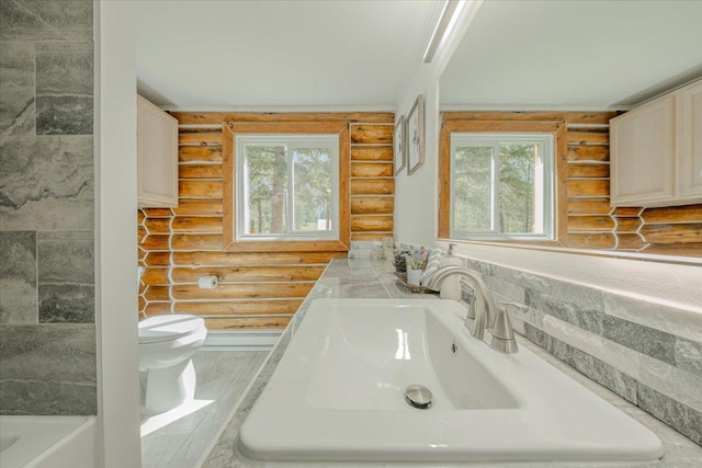 6470 US Highway 93 S, Eureka, MT 59917 - full bathroom featuring rustic walls, vanity, and a tub
