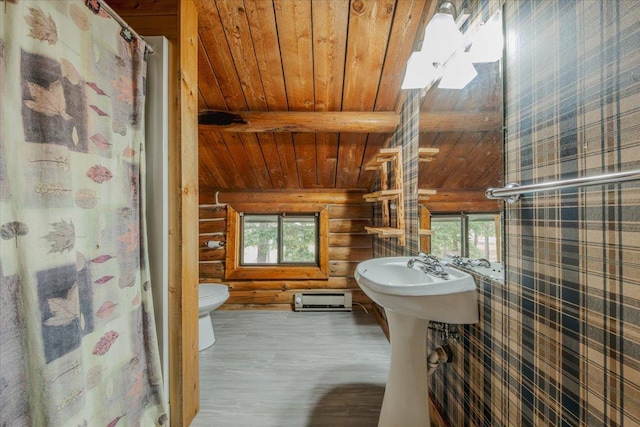 6470 US Highway 93 S, Eureka, MT 59917 - bathroom featuring a wood ceiling with exposed beams, log walls, healthy amount of natural light, wood finished floors, and a shower with shower curtain