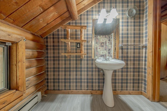 6470 US Highway 93 S, Eureka, MT 59917 - bathroom featuring baseboard heating, wallpapered walls, lofted ceiling, wood finished floors, and rustic walls