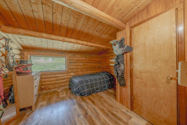 6470 US Highway 93 S, Eureka, MT 59917 - bedroom featuring log walls, a wood ceiling with exposed beams, and hardwood / wood-style floors
