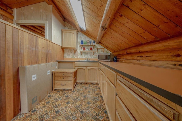 6470 US Highway 93 S, Eureka, MT 59917 - kitchen with vaulted ceiling, light brown cabinetry, stainless steel microwave, wooden ceiling, and open shelves