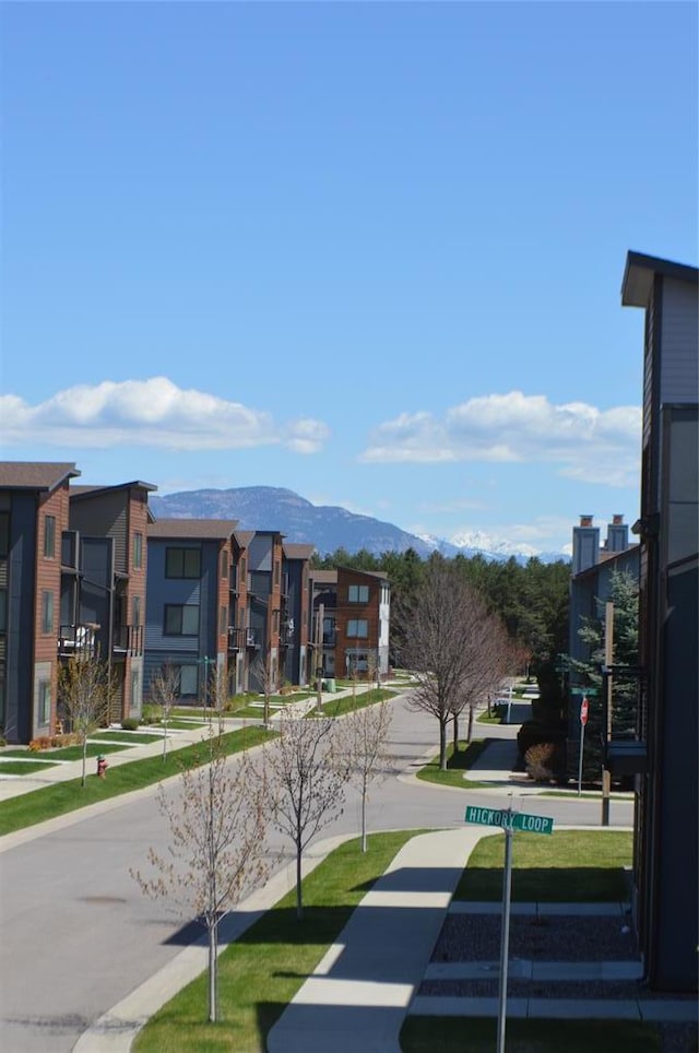 view of home's community with a mountain view and a residential view