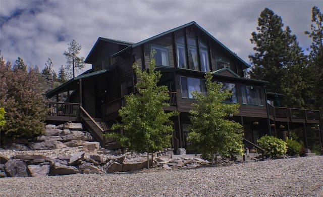 6961 Mt Highway 200, Plains, MT 59859 - view of home's exterior featuring a deck, stairs, and a sunroom