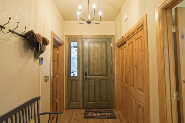 6961 Mt Highway 200, Plains, MT 59859 - entryway featuring wood finished floors and a chandelier