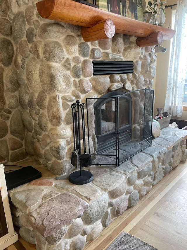 6961 Mt Highway 200, Plains, MT 59859 - detailed view of a stone fireplace and wood finished floors