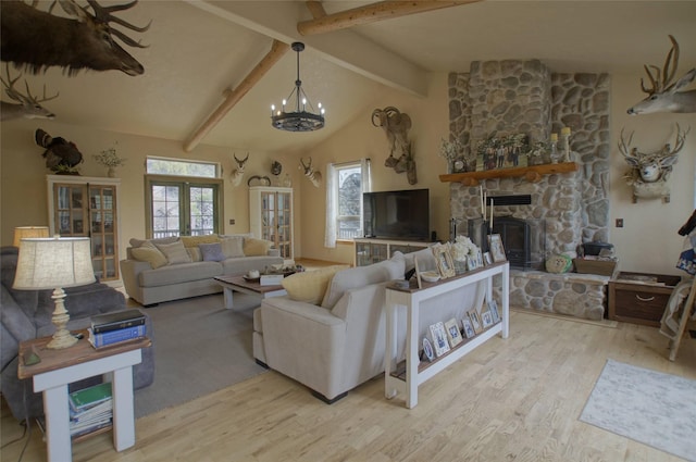 6961 Mt Highway 200, Plains, MT 59859 - living area with wood finished floors, a chandelier, and a fireplace