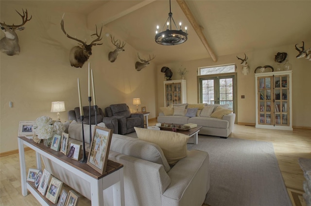 6961 Mt Highway 200, Plains, MT 59859 - living area featuring light wood-style flooring, a chandelier, baseboards, and french doors