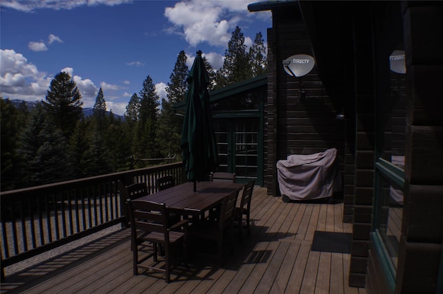 6961 Mt Highway 200, Plains, MT 59859 - deck featuring outdoor dining area and a wooded view