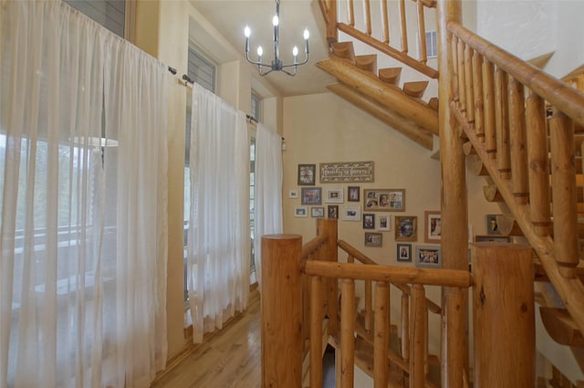 6961 Mt Highway 200, Plains, MT 59859 - stairway with a chandelier and wood finished floors