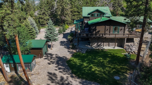 6961 Mt Highway 200, Plains, MT 59859 - view of jungle gym featuring a yard, a wooden deck, and an outdoor structure